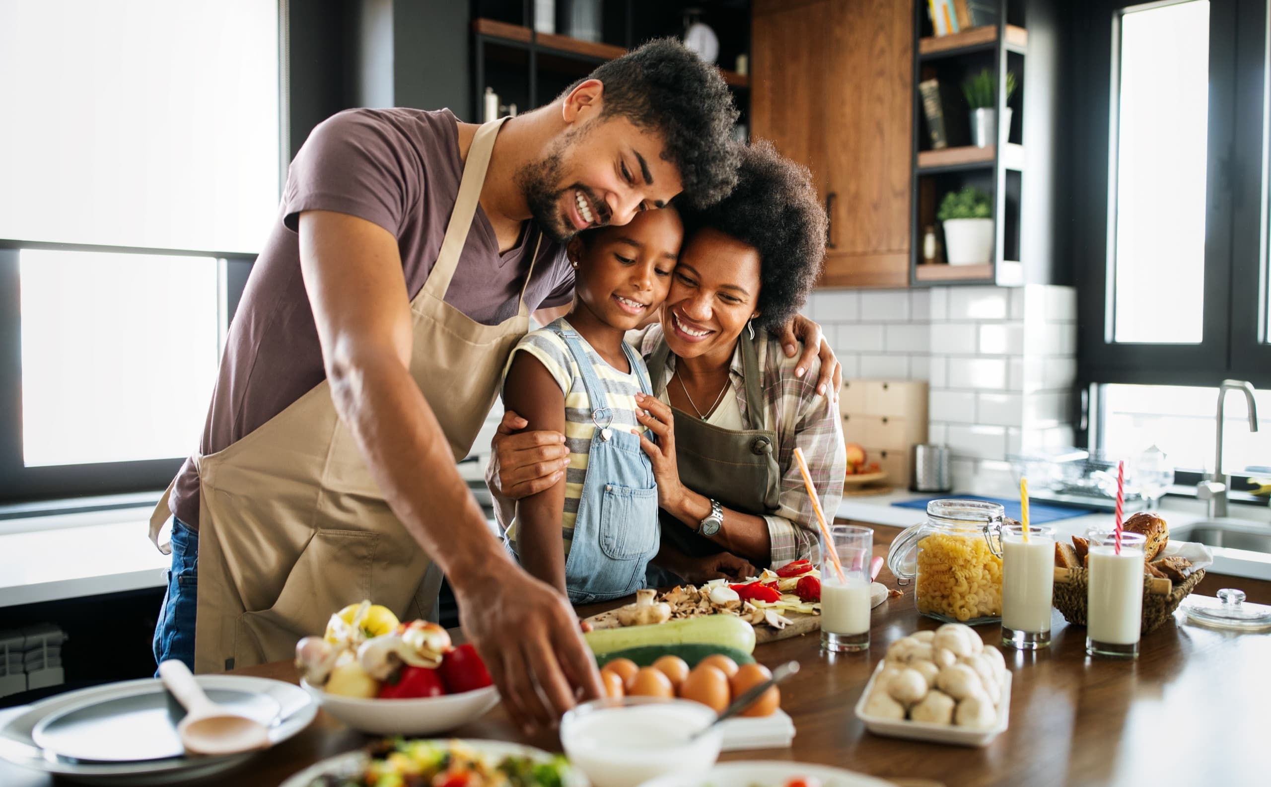 A family preparing food together in their kitchen